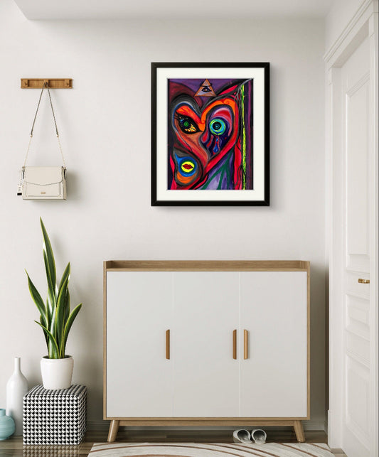 Framed face painting on white wall above dresser, plant, and purse.