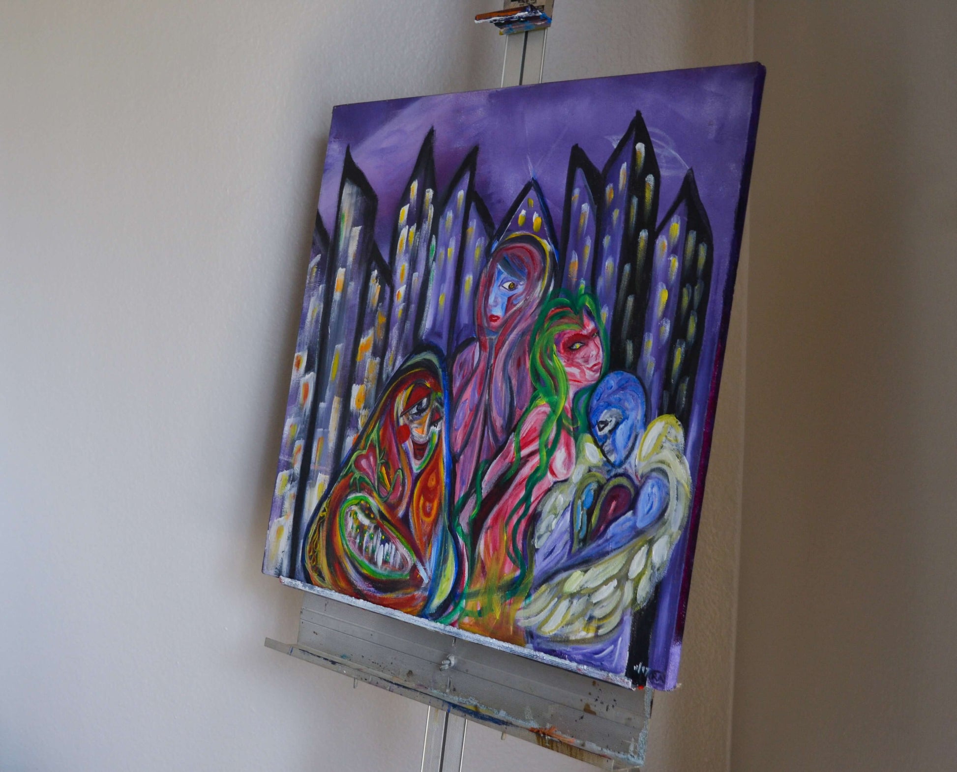 Angled view of purple soul painting on metal easel.