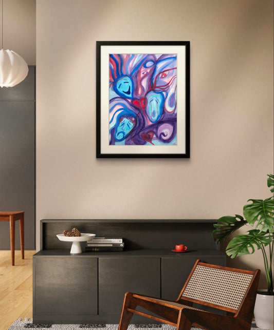 Black framed blue faces painting on white wall above black dresser.