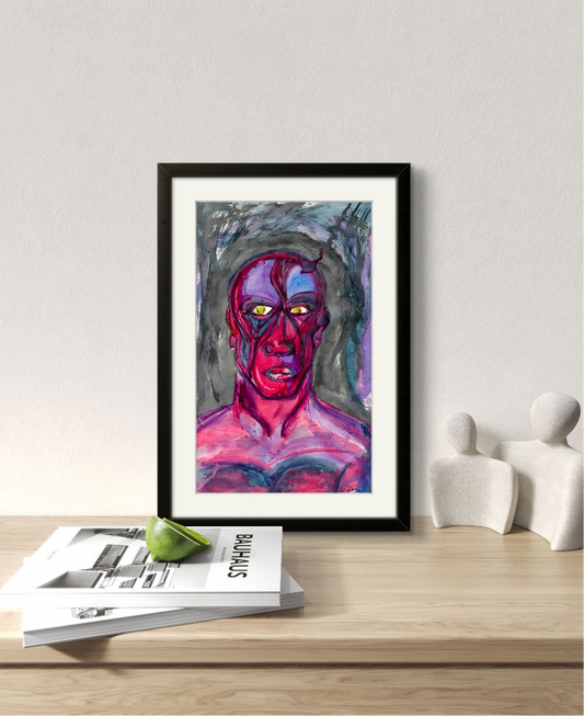 Black framed painting of pink man on wooden table behind magazines.
