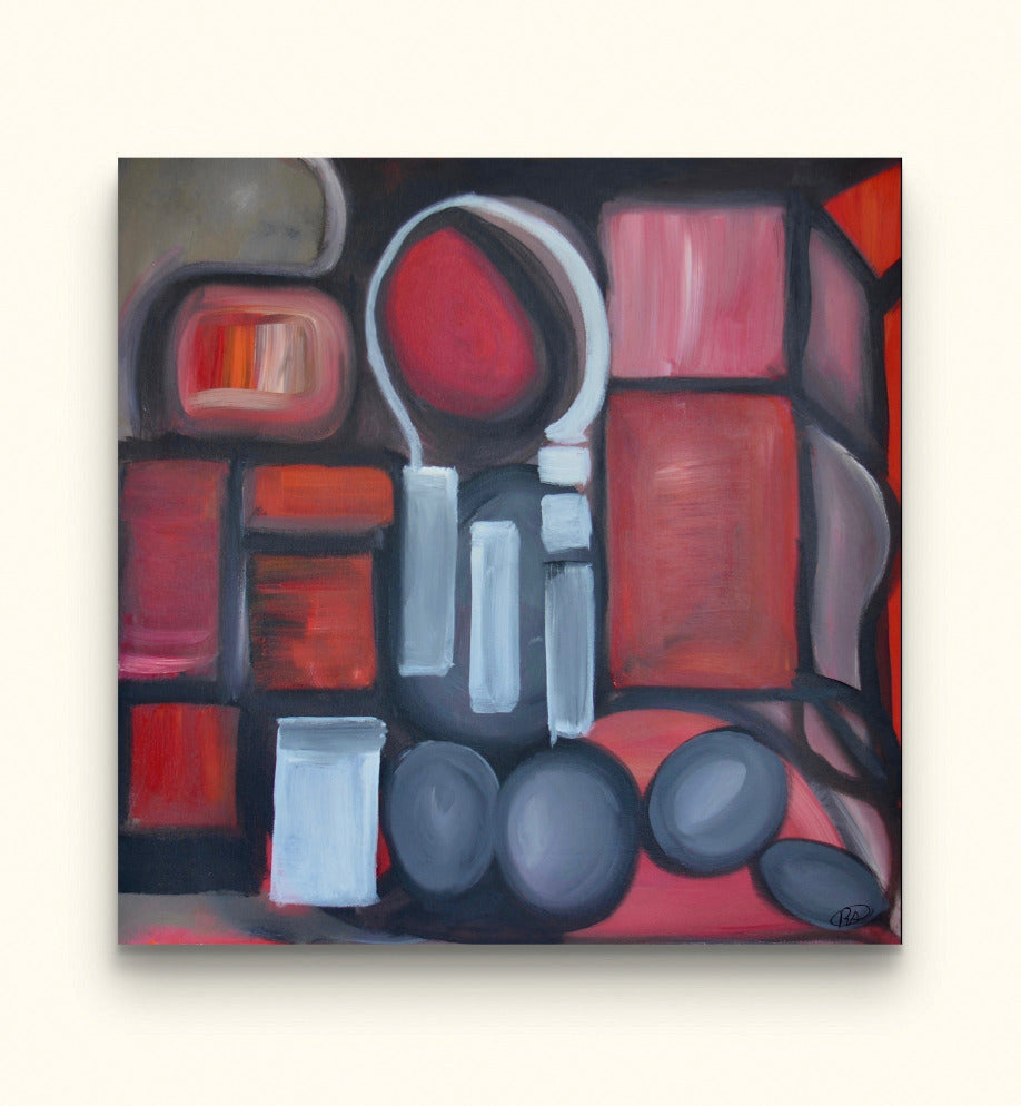 Red shapes painting on beige wall.