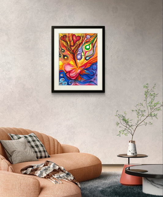 Colorful orb painting on grey wall above orange couch and plant.