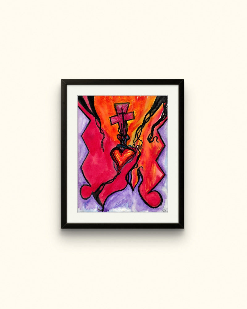 Black framed orange heart painting on beige wall.