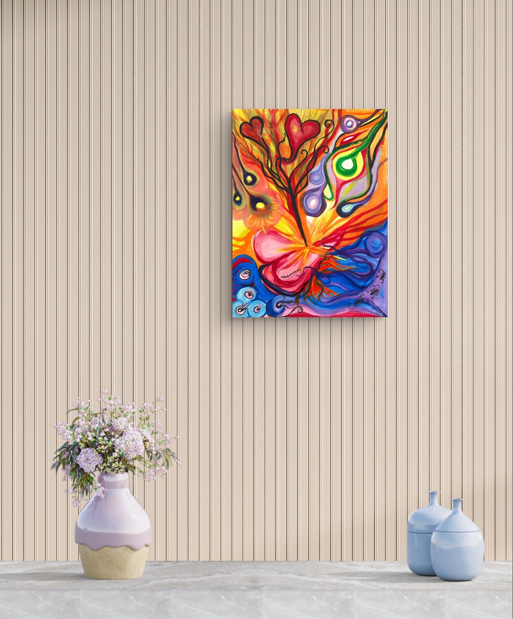 Colorful orb painting on beige striped wall behind flowers.