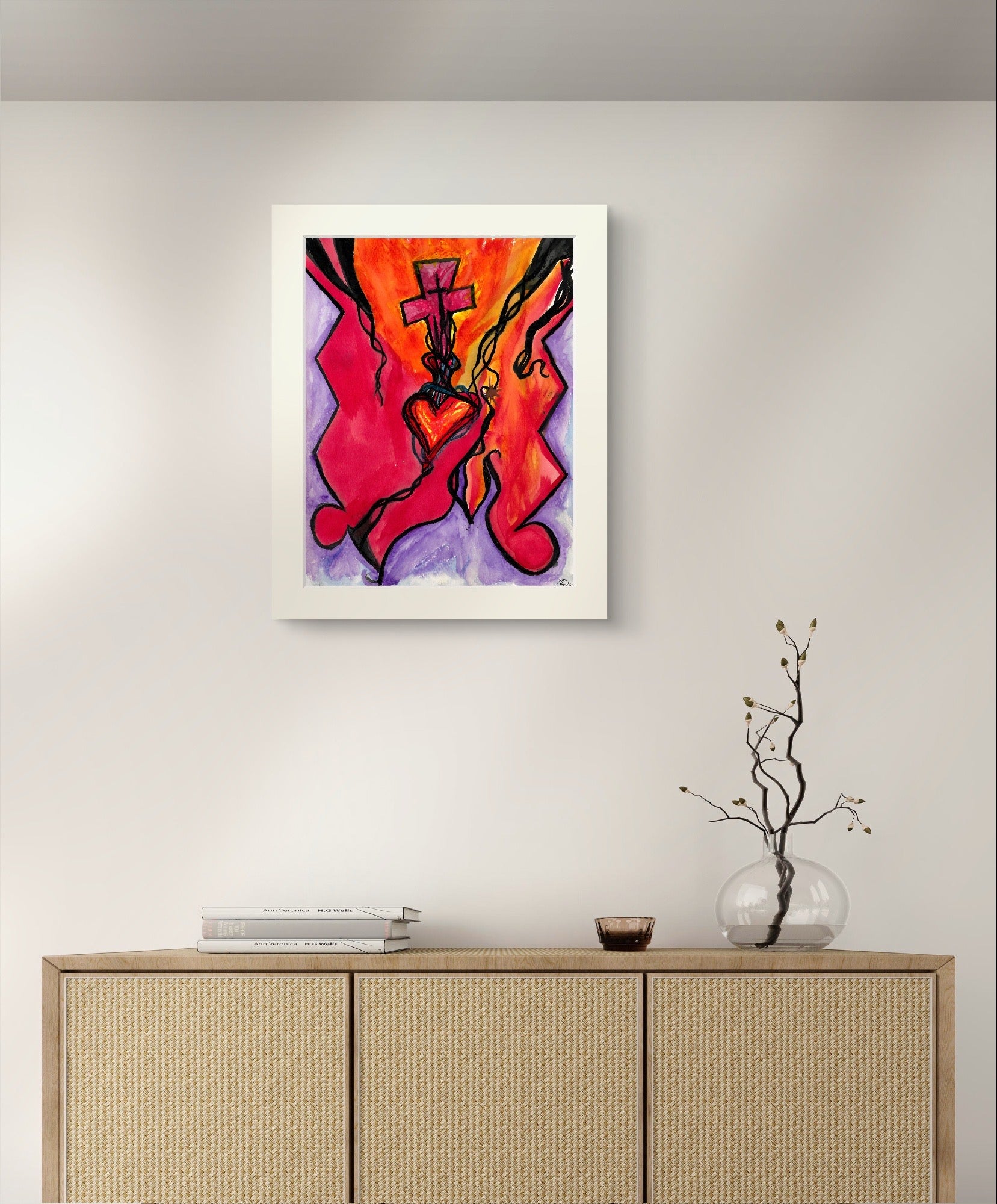 Bordered heart painting on white wall above beige dresser.