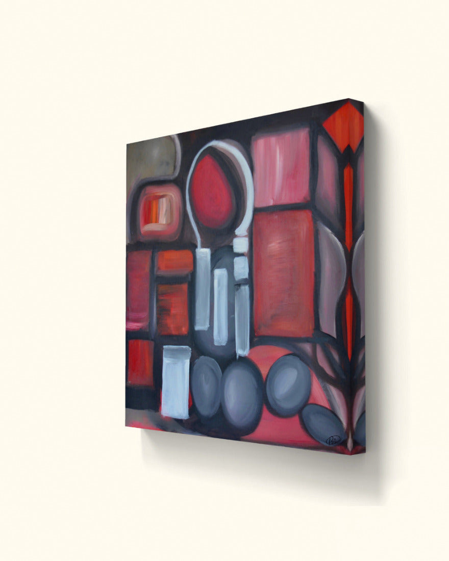 Angled view of red shapes painting on beige wall.