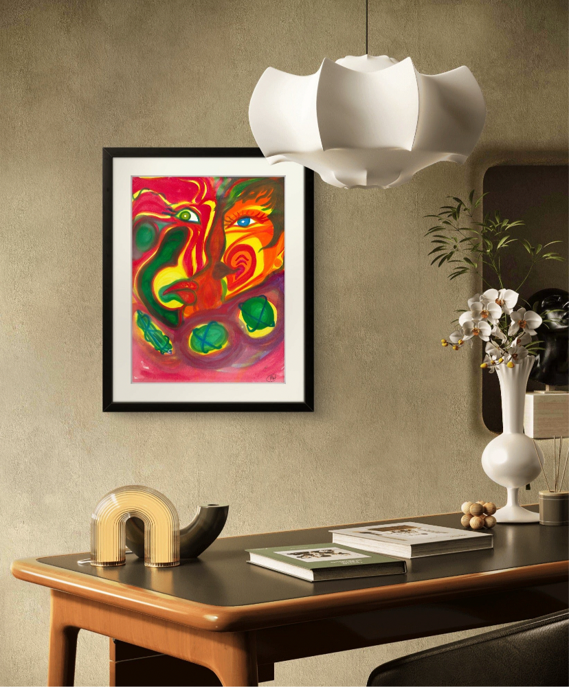 Black framed orange man and woman painting on green wall behind desk.