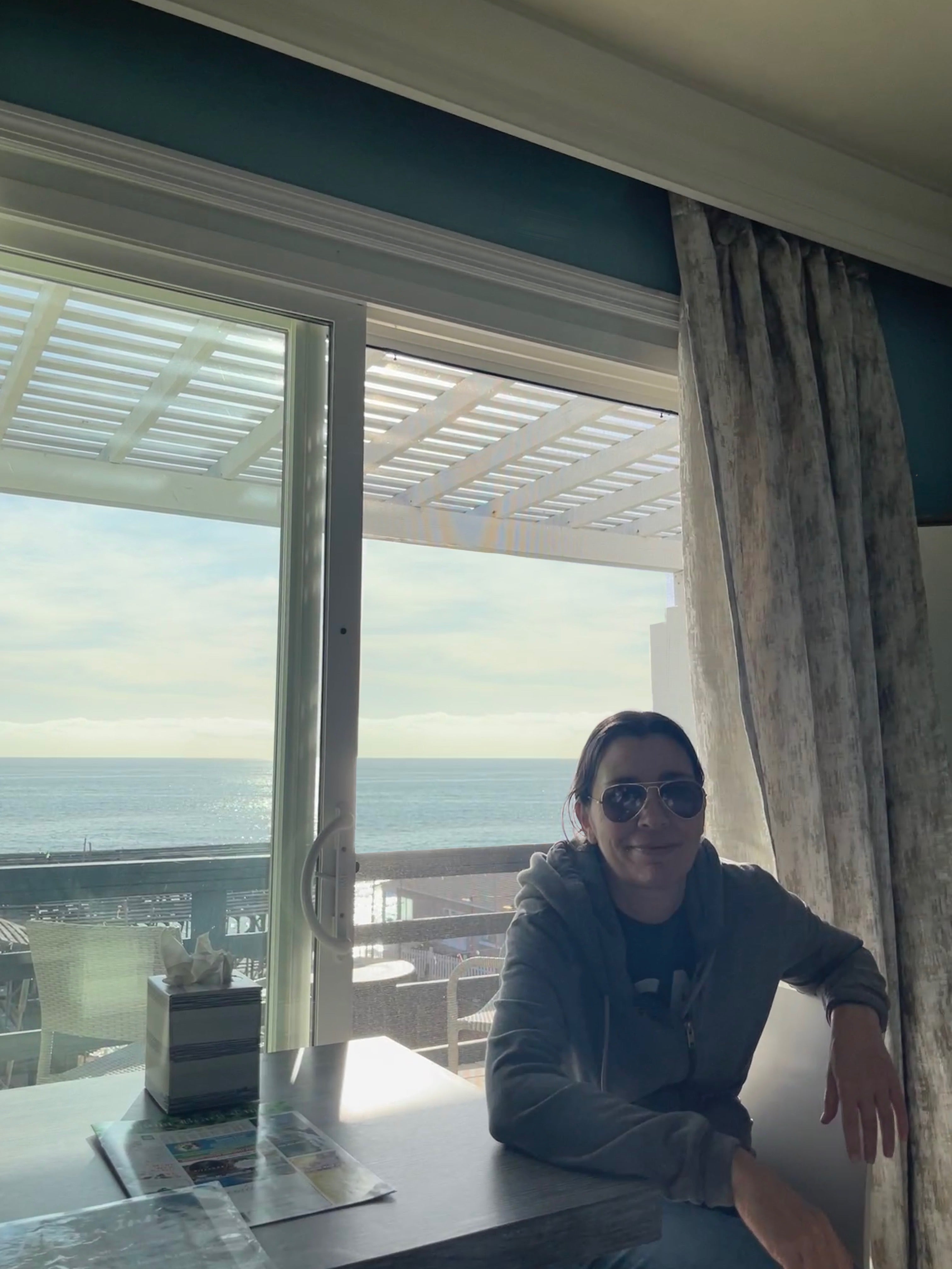 Woman in front of ocean.