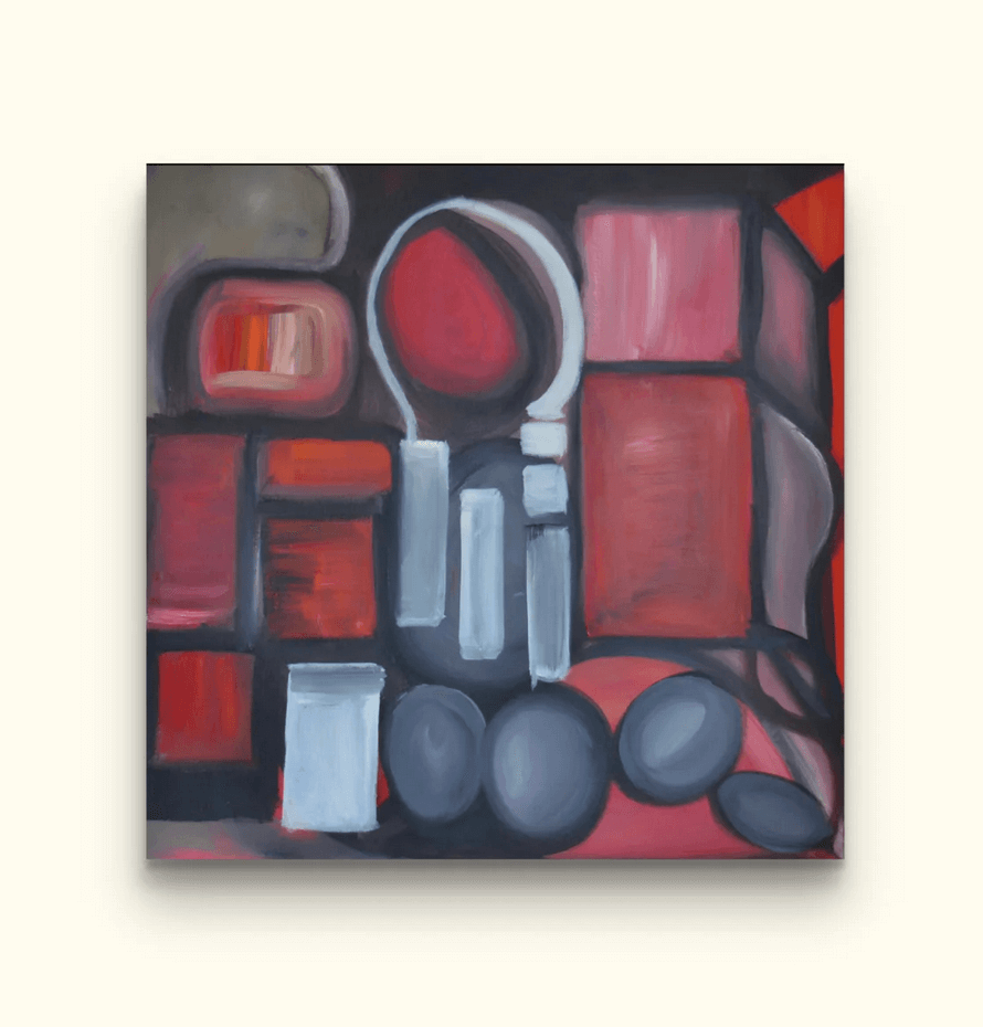 Red shapes painting on beige wall.